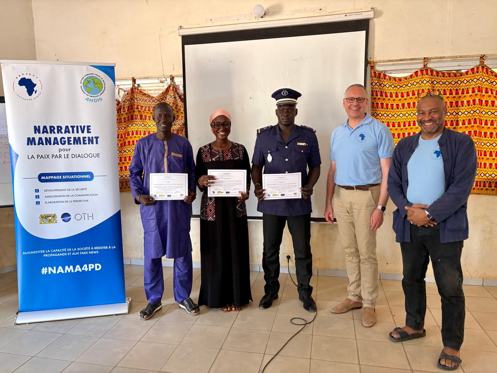 Successful attendees showing their certificates