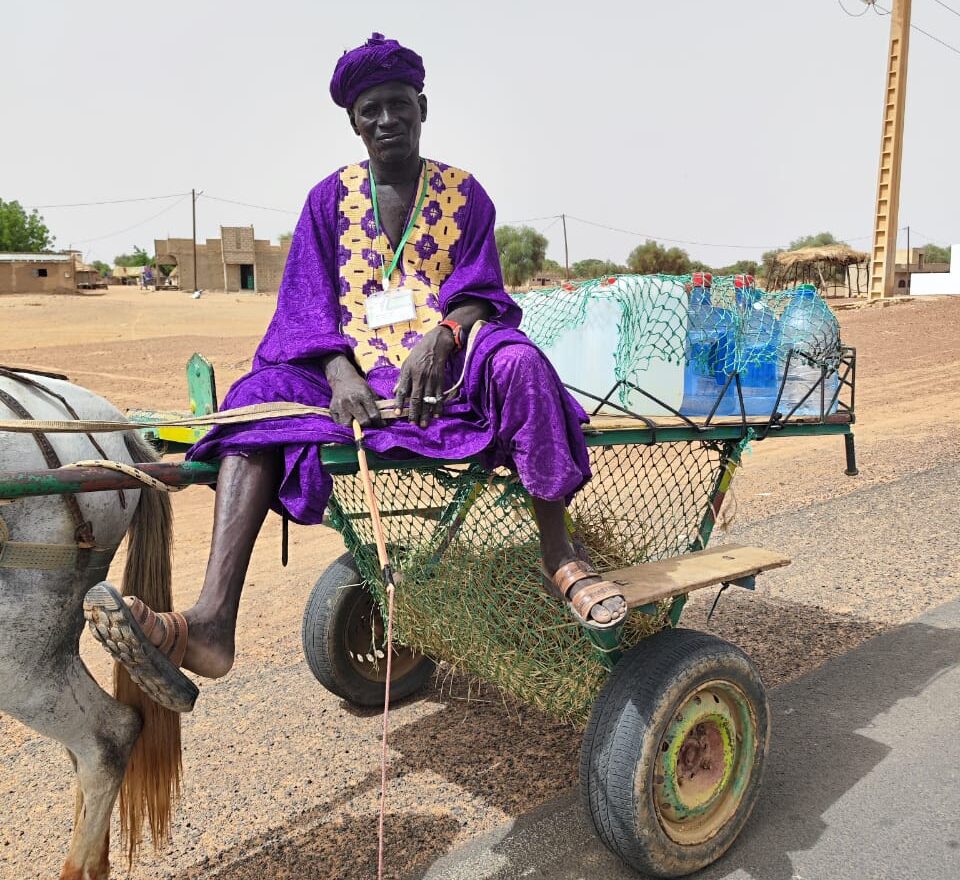 An imam brings a delivery of drinking water to the town of Taredji in northern Senegal